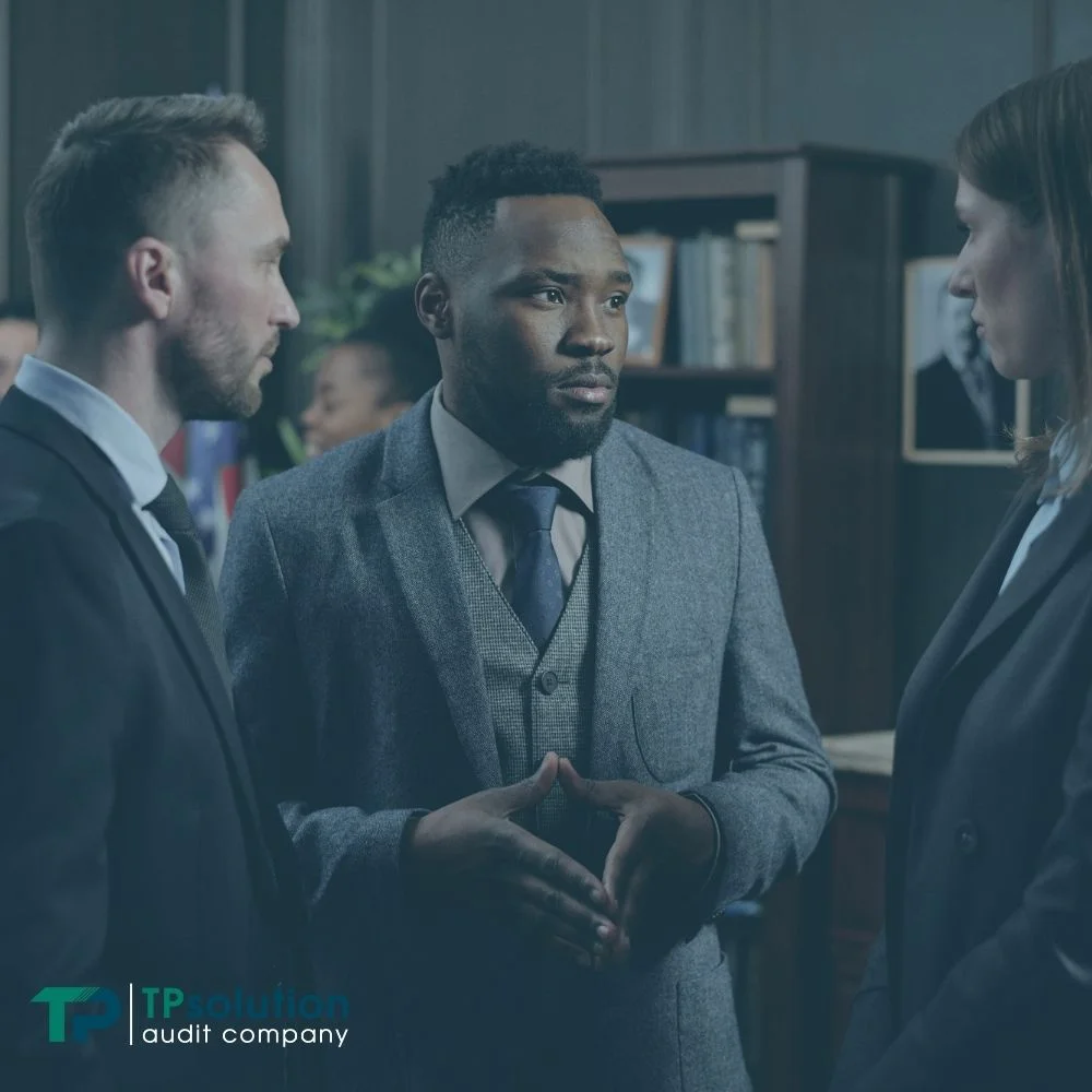 three people having detailed discussion about finances